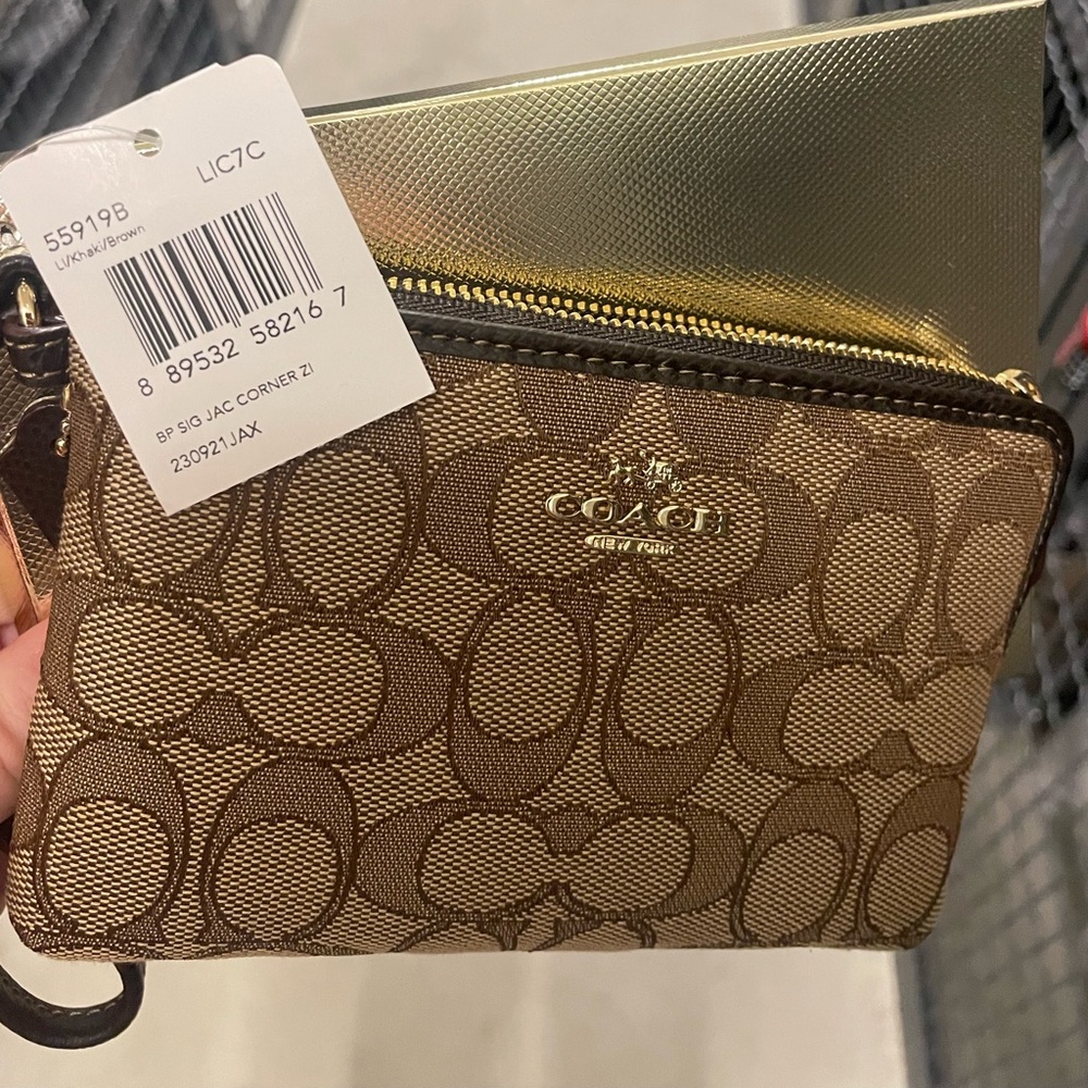 Never been used Coach wristlet with tags